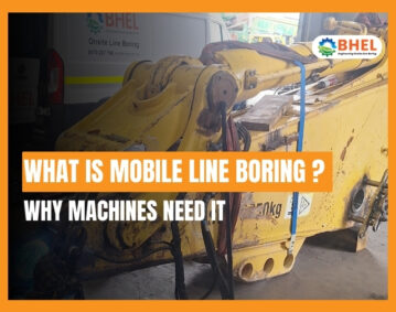 Technician performing mobile line boring on heavy machinery at an industrial site